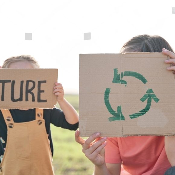 stock-photo-unrecognizable-mother-and-daughter-holding-a-recycle-poster-and-a-future-poster-concept-of-saving-2120721434-transformed