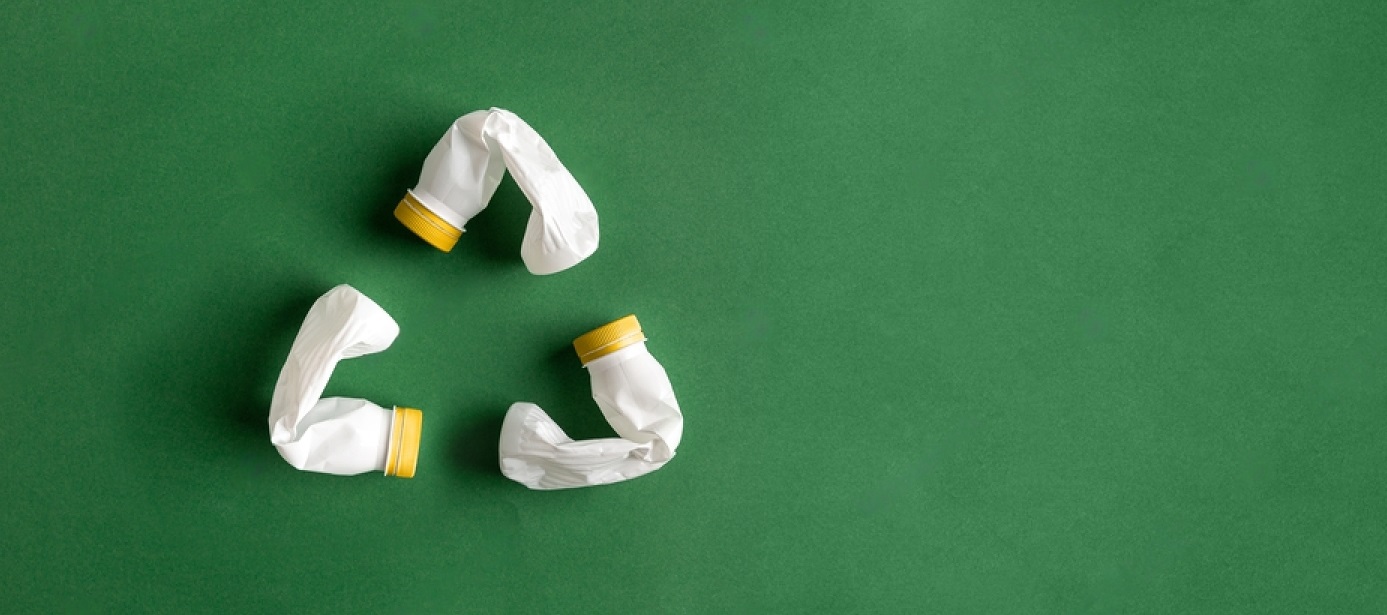 stock-photo-white-recycle-sign-created-of-plastic-bottles-on-green-background-flat-lay-with-copy-space-pet-1788453752-M9KdhjwLp-transformed